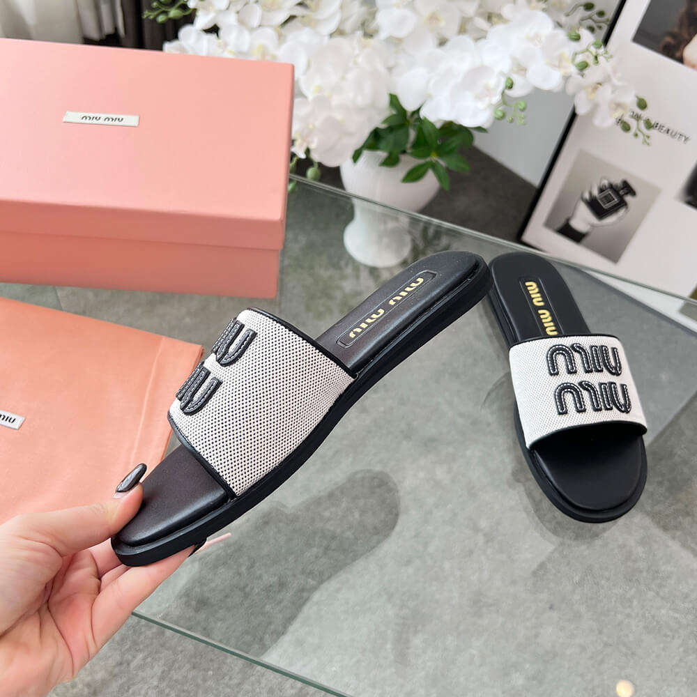 MiuMiu Canvas and leather slides
