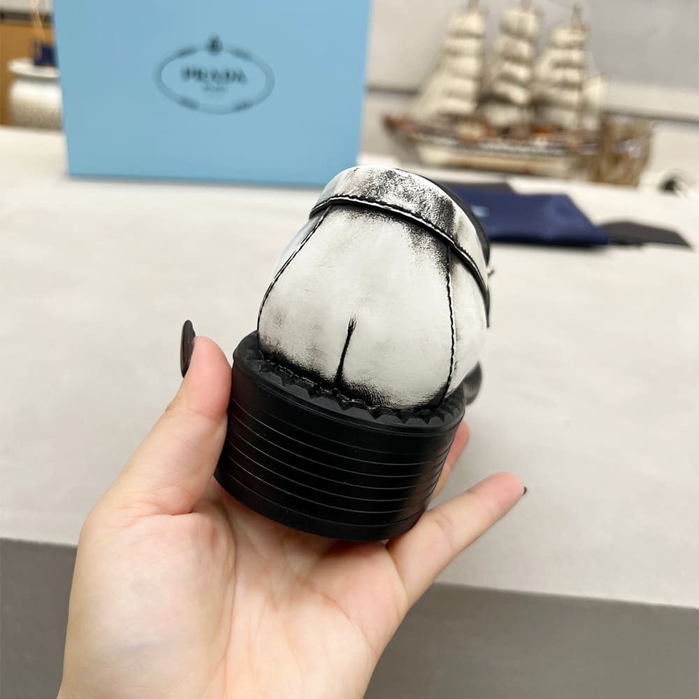 PRADA Brushed leather loafers with metal details